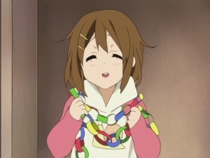 Yui can't resist herself after making all those paper chains...